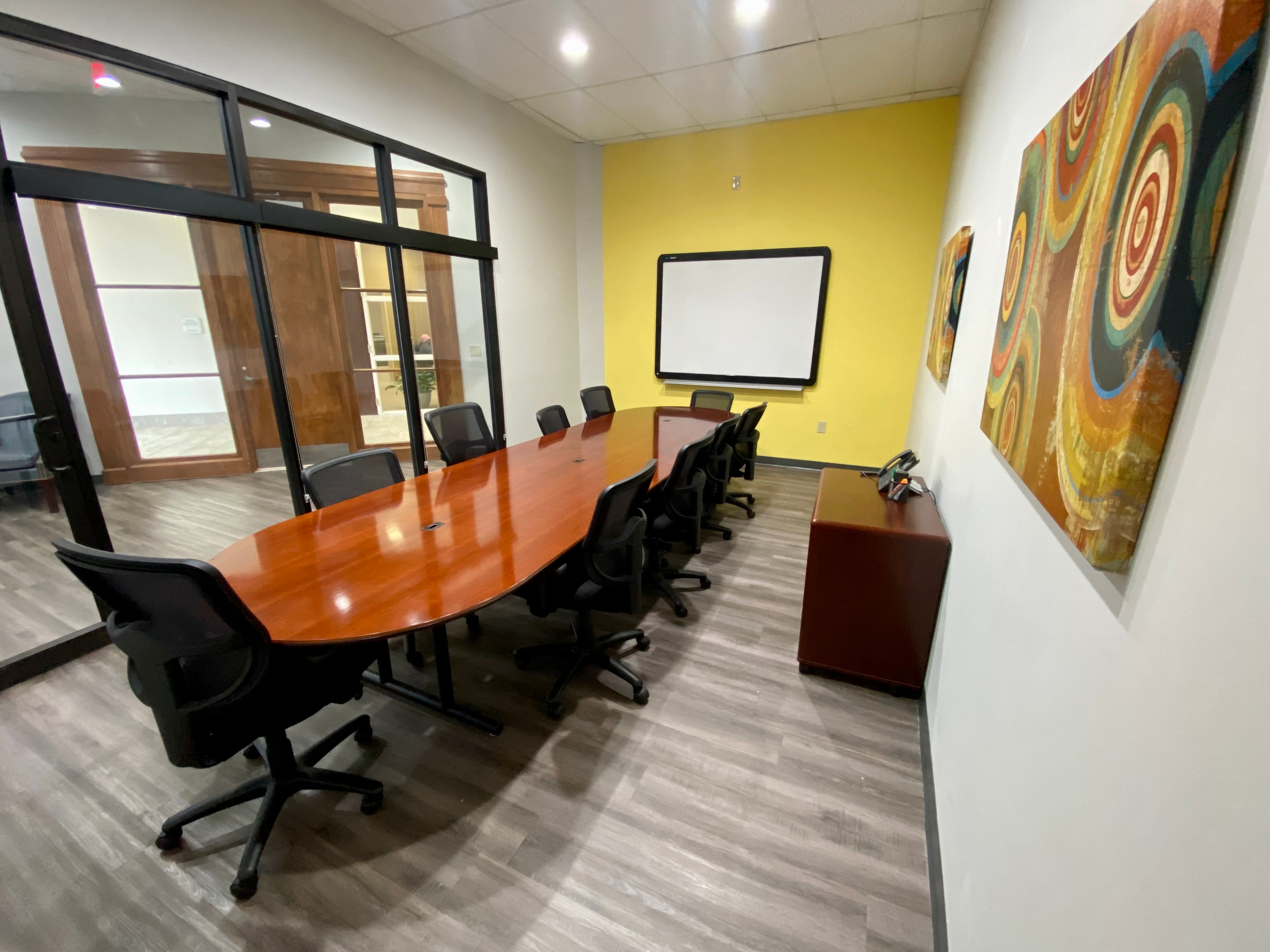 Fully serviced meeting room with conference table at Triad Office Solutions in Jackson, MS